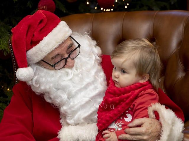 Children meet Father Christmas at Delapre Abbey in December 2022.