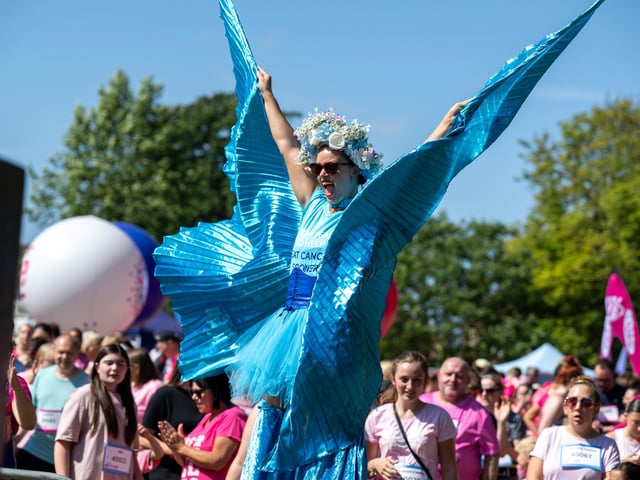 A performer on stilts helping to warm up race goers taking part in the Race For Life at Abington Park in Northampton on Sunday, July, 12, 20026. Photo by David Jackson.