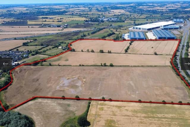 Nearly 100 acres of farmland at Junction 16 of the M1 has been put on the market for £2.85 million.