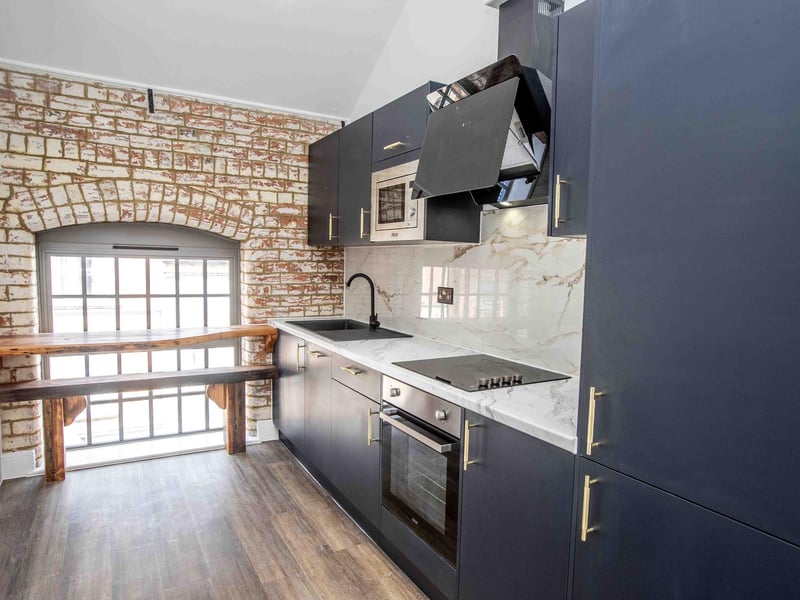 The Grade II listed former shoe factory has been converted into 89 stylish apartments by the OEH Group