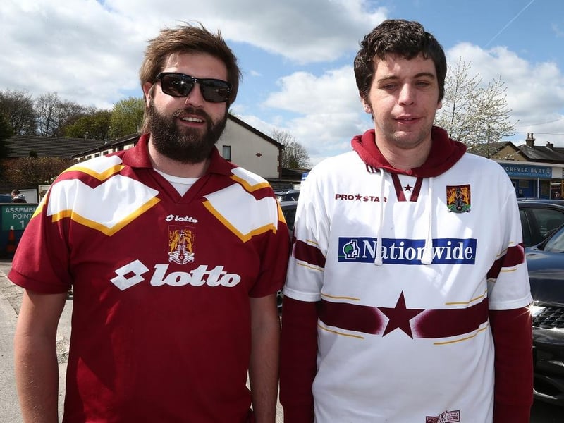 Northampton Town fans attend the game in old shirts from previous seasons during the Sky Bet League One match between Bury and Northampton Town at Gigg Lane on April 22, 2017.