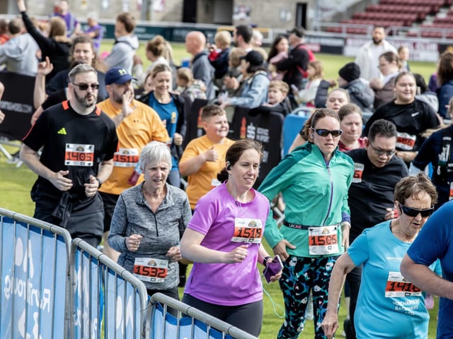 Hundreds of runners braved showers and wind to take on the race on Sunday (May 25), which started and finished at Sixfields stadium.