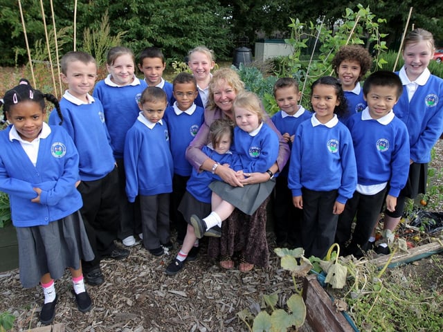 2009: Briar Hill Primary School which was awarded a 'satisfactory' judgement in their Ofsted report. Pictured: Head Cath Keohane with pupils.