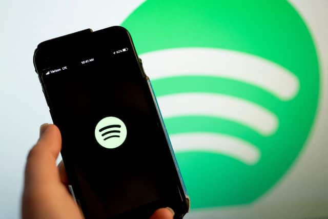 This illustration photo shows the Spotify logo (Photo by Stefani Reynolds / AFP) (Photo by STEFANI REYNOLDS/AFP via Getty Images)