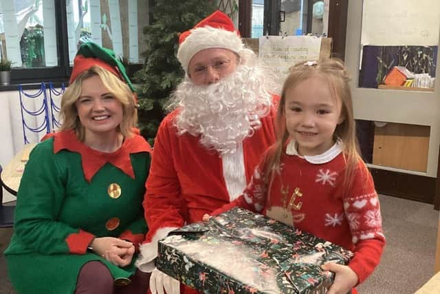 Santa and his elves delivered the pupils their presents ahead of the end of the school term.