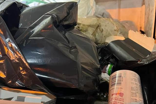 Picking up litter on the A43 roadside at night