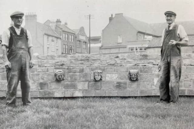 Local builder William Branson (right), building the memorial square wall in 1951