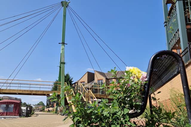 A broken CCTV camera (on top of the green pole structure) overlooking the bench (pictured) where Robert Brown was found fatally injured has been out of action since 2013