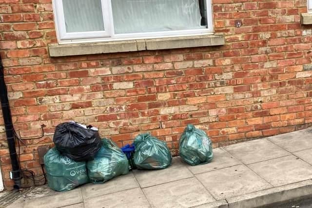 Ionescu left these bags of rubbish outside someone else's house in a street in Semilong, Northampton