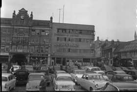 Northampton Market Square circ 1964 showing Chron building and Emporium Arcade, which was demolished in the 1970s. When there was no market, the square became a popular free car park.