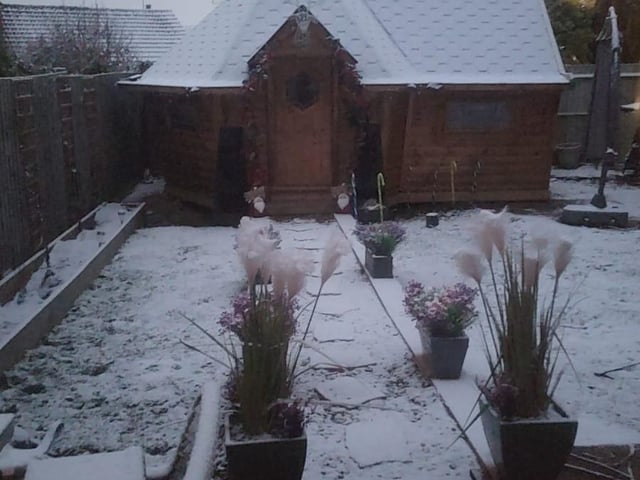 Snowy garden cabin.