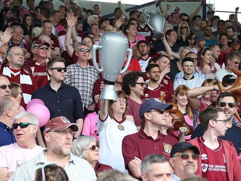 Northampton Town fans welcome there team on the pitch prior to the Sky Bet League Two match between Portsmouth and Northampton Town at Fratton Park on May 7, 2016.