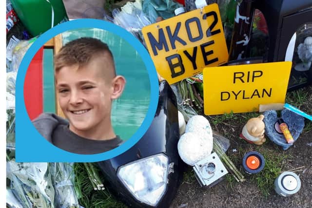 A family photo of Dylan Holliday with the floral tributes left near the A509 underpass last year