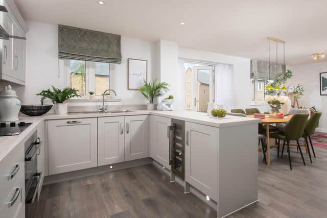 BN - The kitchen and dining area inside a Barratt Homes property
