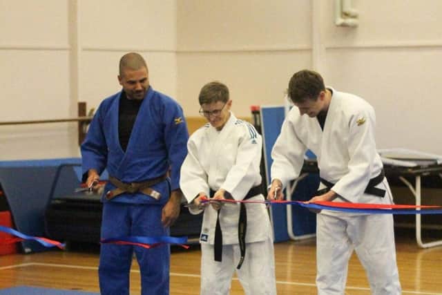 The coaches at Judo Academy Northampton officially opened the new mats during the grand opening.