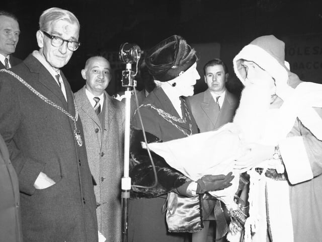 Father Christmas presents Northampton Mayoress with flowers