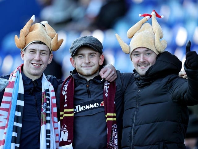 Northampton Town fans with festive head wear during the Sky Bet League Two between Mansfield Town and Northampton Town at One Call Stadium on December 26, 2022.