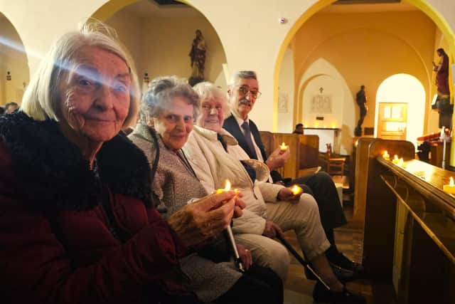 Residents from Elm Bank Care Home enjoying Carols By Candlelight Service at St Edwards Church in Kettering.