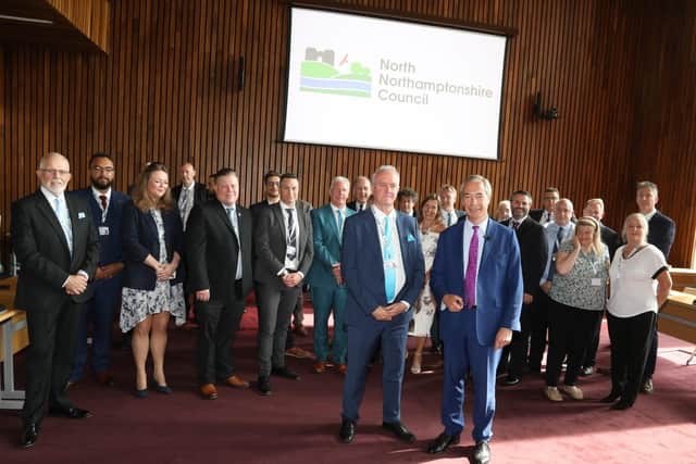 Reform UK leader Nigel Farage with Reform councillors of North Northants Council at the Corby Cube/National World