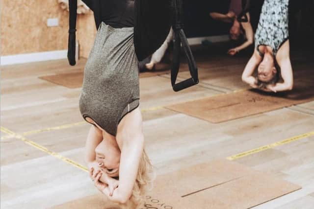 Among the classes starting at Soo Yoga before the end of this month is antigravity yoga, pictured here.