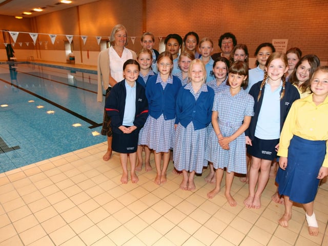 Year six pupils from Northampton High School junior school site next to the swimming pool, with Sally Norris, year six class teacher and Wendy Nugent, head of the junior school. Pictured in 2007.