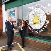Lee Ferris and Melissa Bratton at the Bell of Northampton store on Kingsthorpe Road, which features the new logo as part of a prominent window display.