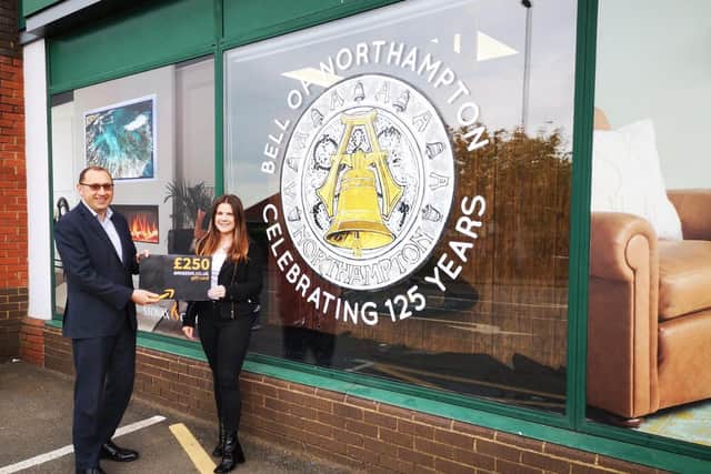 Lee Ferris and Melissa Bratton at the Bell of Northampton store on Kingsthorpe Road, which features the new logo as part of a prominent window display.
