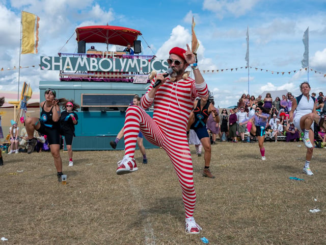 Monsieur Bonbon leading festival goers through a quick bit of dancing between games at the Shambolympics at Shambala on Sunday, August 30, 2026. Photo by David Jackson.