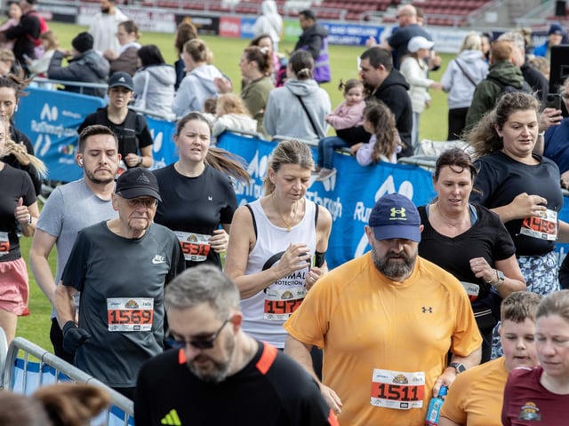 Hundreds of runners braved showers and wind to take on the race on Sunday (May 25), which started and finished at Sixfields stadium.