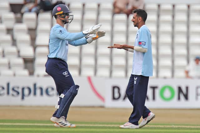 Yuzi Chahal celebrates claiming a wicket with Lewis McManus (Picture: Peter Short)