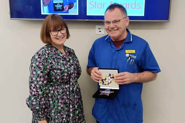 CEO Dr Vivian McVey presented Nurse Manager Damien Crossan with his Cavell Star 