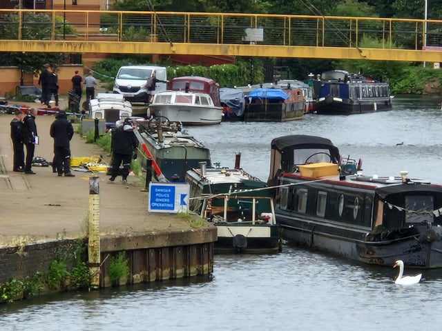 Pictures from day four of a murder probe by the River Nene near Beckets Park, where a man was found dead on a bench early Friday morning (August 1). Northamptonshire Police divers were searching the water on Monday morning (August 4) and are appealing for witnesses.