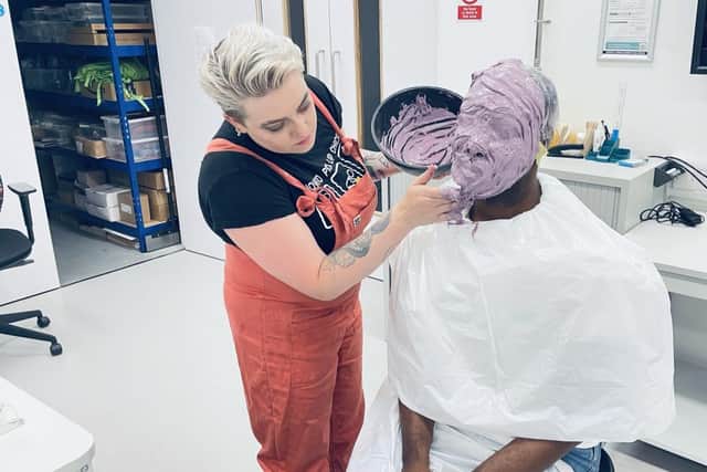 Dr Nickey Hardy's head is covered during the creation of the mask