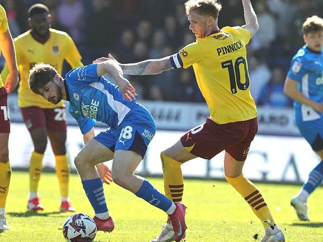 Mitch Pinnock, who finished the game as captain, battles Cian Hayes for possession
