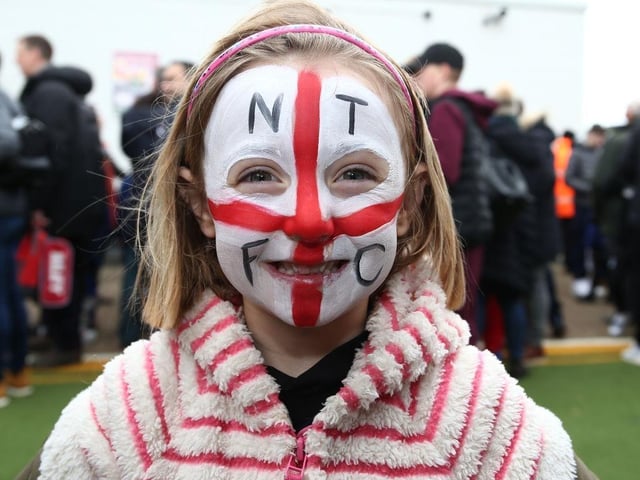 A Young Northampton Town fan with a painted face looks on prior to the Sky Bet League Two match between Northampton Town and Exeter City at PTS Academy Stadium on February 22, 2020.