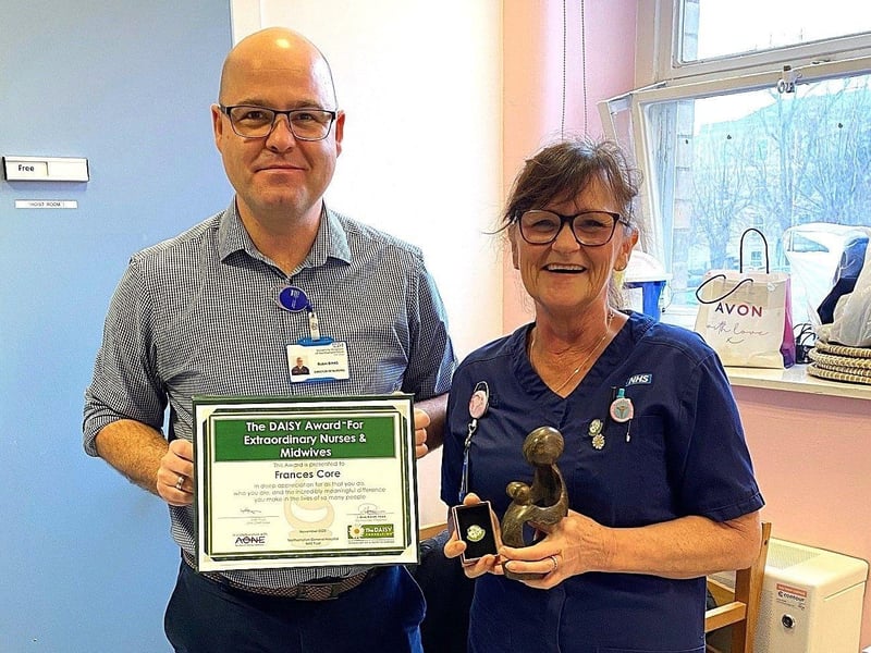 Staff Nurse Frances Core receives her award from Director of Nursing Robin Binks