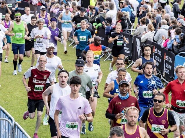 Hundreds of runners braved showers and wind to take on the race on Sunday (May 25), which started and finished at Sixfields stadium.