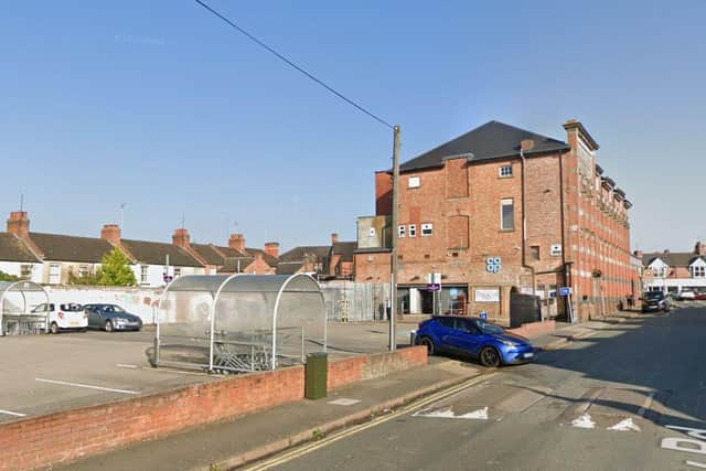 Developers are looking to replace the car spaces at the far end of the Barry Road Co-op parking area with two new homes. Credit: Google Maps
