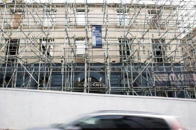 The former Fat Cats bar burned down in 2012 and has had scaffolding around it ever since.