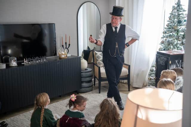 BN - SGB-25886 - Mark Fraser performing for the pupils of Priors Hall ALC in a David Wilson Homes sh