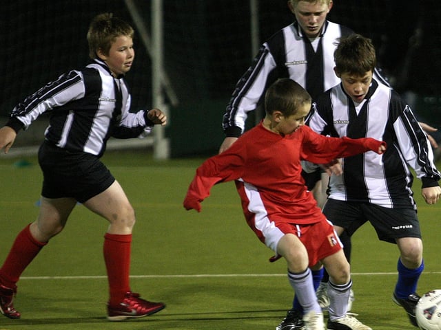 A football tournament at Unity College, organised by Northampton School Sports Partnership. Football action from Vernon Terrace Primary School (black and white), V Chiltern Primary School (red).