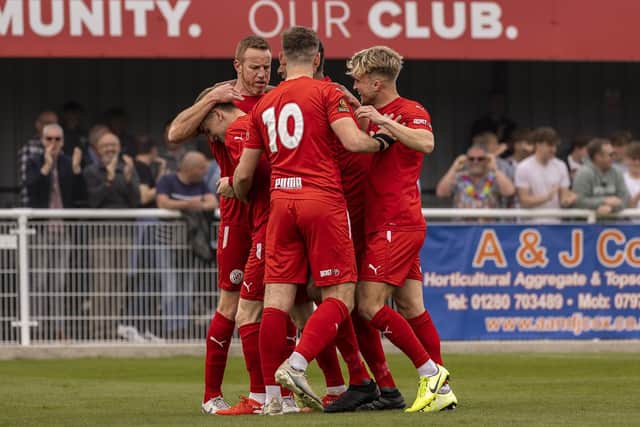The Brackley players celebrate Alfie Bates' goal in Saturday's 1-1 draw with Alfreton Town, which sealed their spot in the play-offs