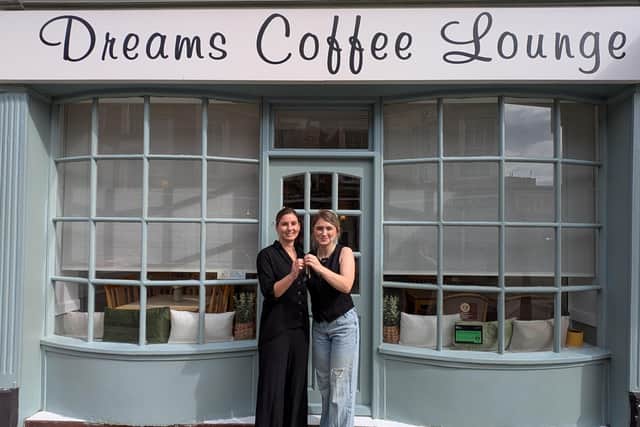Lisa Neophitou (left) hands over the keys to new owner Mariola Fuller (right), marking a new chapter for Dreams Coffee Lounge on St Giles Street.