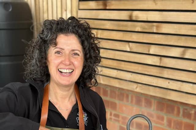 Tammy Pell with her paella dish cooked over a live fire on a Kadai