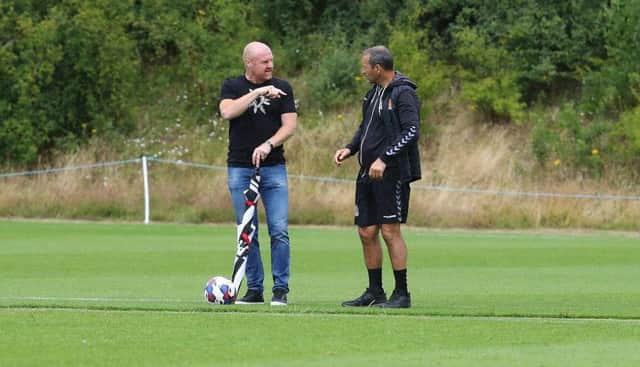 Sean Dyche in conversation with Cobblers assistant Colin Calderwood during pre-season.