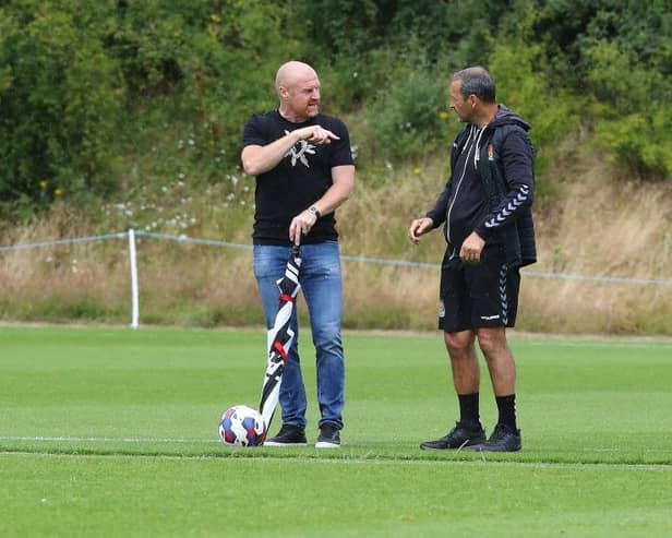 Sean Dyche in conversation with Cobblers assistant Colin Calderwood during pre-season.
