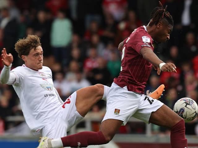 Akin Odimayo gets away from Barnsley's Callum Styles at Sixfields (Picture: Pete Norton)