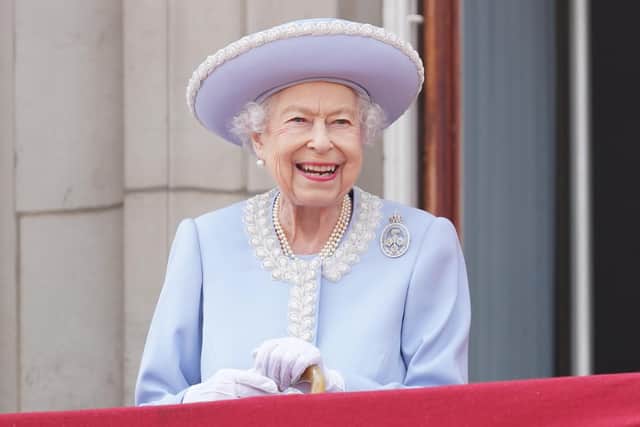 Queen Elizabeth II watches from the balcony of Buckingham Palace during the Trooping the Colour parade the Trooping the Colour parade on June 2, 2022 (Photo by Jonathan Brady - WPA Pool/Getty Images)