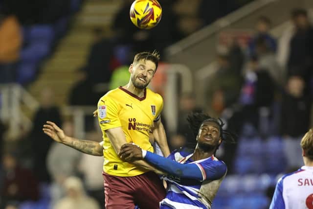 Jon Guthrie wins a header.