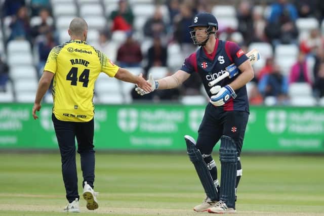 Jimmy Neesham shakes hands with Durham's Ben Raine following the Steelbacks' win at Durham on Sunday